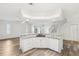 Bright kitchen with granite countertops, white cabinets, and modern appliances open to the living area at 3209 Meta Ct, Largo, FL 33771