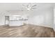 Spacious living room with wood flooring connected to the kitchen and dining area at 3209 Meta Ct, Largo, FL 33771