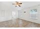 The main bedroom features neutral walls, tile flooring, a ceiling fan and access to the en-suite bathroom at 3209 Meta Ct, Largo, FL 33771