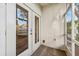 Screened patio with double doors leading inside and a view of the backyard at 3209 Meta Ct, Largo, FL 33771