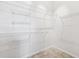 Spacious walk-in closet with extensive white wire shelving and tile floor at 3209 Meta Ct, Largo, FL 33771