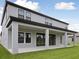 Wide angle view of the backyard with a large covered patio at 3483 Yellow Leaf Cir, Spring Hill, FL 34609