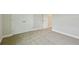 Bedroom showcasing neutral carpet, closet doors, and ample space at 3483 Yellow Leaf Cir, Spring Hill, FL 34609