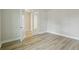 Bright bedroom features light wood flooring and an open doorway at 3483 Yellow Leaf Cir, Spring Hill, FL 34609