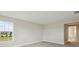 Spacious carpeted bedroom with two large windows offering ample natural light and neighborhood views at 3483 Yellow Leaf Cir, Spring Hill, FL 34609