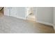Carpeted area leading to bathroom with white trim and neutral walls at 3483 Yellow Leaf Cir, Spring Hill, FL 34609