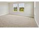 Comfortable bedroom with neutral carpet, natural light and a view of green backyard at 3483 Yellow Leaf Cir, Spring Hill, FL 34609