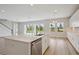 Spacious kitchen with an island, stainless steel dishwasher and views of the backyard at 3483 Yellow Leaf Cir, Spring Hill, FL 34609