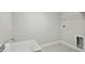 Bright laundry room features a sink and wire shelving at 3483 Yellow Leaf Cir, Spring Hill, FL 34609
