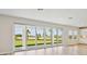 Spacious living area featuring sliding glass doors offering a scenic outdoor view and natural light at 3483 Yellow Leaf Cir, Spring Hill, FL 34609