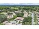 Expansive aerial shot featuring residential homes, a golf course, and abundant green spaces in the community at 3504 Wedge Way, New Port Richey, FL 34655