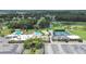 Beautiful aerial view of community amenities including a golf course, pool, and tennis courts at 3504 Wedge Way, New Port Richey, FL 34655