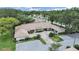 Aerial view showcases well-maintained townhome community with mature trees at 3504 Wedge Way, New Port Richey, FL 34655