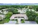 Panoramic aerial view of the property highlighting its location within a lush, green neighborhood at 3504 Wedge Way, New Port Richey, FL 34655