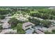 An aerial view showcasing the community with its lush landscaping, golf course, and well-maintained homes at 3504 Wedge Way, New Port Richey, FL 34655