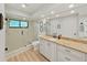 The bathroom features a glass shower, granite countertop, and modern fixtures at 3504 Wedge Way, New Port Richey, FL 34655