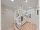 Updated bathroom featuring a glass shower, granite counters, and modern fixtures at 3504 Wedge Way, New Port Richey, FL 34655