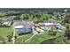 Aerial perspective of community amenities including pools, tennis courts, and golf course, with well-maintained landscaping at 3504 Wedge Way, New Port Richey, FL 34655