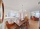 Open dining room with hardwood floors and view into the kitchen at 3504 Wedge Way, New Port Richey, FL 34655