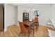 A traditional dining room that flows into a kitchen with a peninsula and bar stool seating at 3504 Wedge Way, New Port Richey, FL 34655
