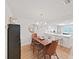 Dining room showcasing a wooden table with seating and chandelier at 3504 Wedge Way, New Port Richey, FL 34655