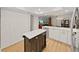 This kitchen has a dark butcher block island with white countertops and stainless steel appliances at 3504 Wedge Way, New Port Richey, FL 34655