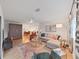 Inviting living room with hardwood floors and access to the dining room at 3504 Wedge Way, New Port Richey, FL 34655