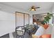 This sunroom offers bright light and an outdoor view, with comfortable wicker furniture and a stylish ceiling fan at 3504 Wedge Way, New Port Richey, FL 34655