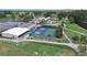Overhead shot of the community tennis and pickleball courts, clubhouse, golf course and parking at 3504 Wedge Way, New Port Richey, FL 34655