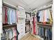 Spacious walk-in closet with custom shelving, hanging rods, and drawers for organized storage at 3504 Wedge Way, New Port Richey, FL 34655