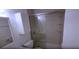 Bathroom with shower cabin and white tiles at 3513 Danny Bryan Blvd, Tampa, FL 33619