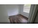 Cozy bedroom with hardwood floors, a large window, and fresh paint at 3513 Danny Bryan Blvd, Tampa, FL 33619