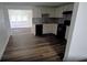 Bright kitchen with plenty of cabinet space, modern appliances, and dark hardwood floors at 3513 Danny Bryan Blvd, Tampa, FL 33619
