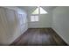 Bright living room with vaulted ceilings, windows, and fresh paint at 3513 Danny Bryan Blvd, Tampa, FL 33619