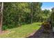 The backyard features lush green space and a wooded area, perfect for relaxing and enjoying nature at 3521 Kings Rd # 105, Palm Harbor, FL 34685