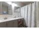 Bathroom with double sink vanity, makeup area, and shower/tub at 3521 Kings Rd # 105, Palm Harbor, FL 34685