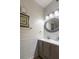 Charming half-bathroom featuring shiplap accent wall and modern fixtures and decor at 3521 Kings Rd # 105, Palm Harbor, FL 34685