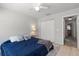 Cozy bedroom with a comfortable bed, soft lighting, and a closet for ample storage at 3521 Kings Rd # 105, Palm Harbor, FL 34685