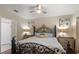 Bedroom with decorative metal bed frame and wall decor at 3521 Kings Rd # 105, Palm Harbor, FL 34685