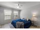 Comfortable bedroom showcasing a bed with stylish linens, soft lighting, and a cozy ambiance at 3521 Kings Rd # 105, Palm Harbor, FL 34685