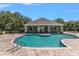 Inviting community pool with a large deck, perfect for lounging and socializing at 3521 Kings Rd # 105, Palm Harbor, FL 34685