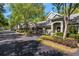 Charming townhouse exterior featuring well-maintained landscaping, neutral paint, and attached garages at 3521 Kings Rd # 105, Palm Harbor, FL 34685