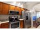 Bright kitchen featuring stainless steel appliances, updated countertops, and modern fixtures at 3521 Kings Rd # 105, Palm Harbor, FL 34685