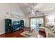 Bright living room with wood floors, vaulted ceilings, and access to lanai at 3521 Kings Rd # 105, Palm Harbor, FL 34685