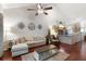 Spacious living room with vaulted ceilings, wood floors, and an open layout at 3521 Kings Road #105 at 3521 Kings Rd # 105, Palm Harbor, FL 34685