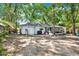Spacious backyard with a screened-in porch and ample space for outdoor activities and relaxation at 3615 Greatwood Ct, Land O Lakes, FL 34639