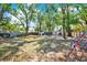 Large backyard with mature trees and a shed, perfect for outdoor activities and storage space at 3615 Greatwood Ct, Land O Lakes, FL 34639