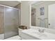 Bathroom featuring a shower with glass doors, large vanity and updated fixtures at 3615 Greatwood Ct, Land O Lakes, FL 34639
