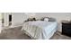 Spacious bedroom features carpeted floors, a comfortable bed, and ample natural light at 3615 Greatwood Ct, Land O Lakes, FL 34639