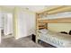 Bedroom with bunk beds, carpeted floors, white closet doors and natural light at 3615 Greatwood Ct, Land O Lakes, FL 34639